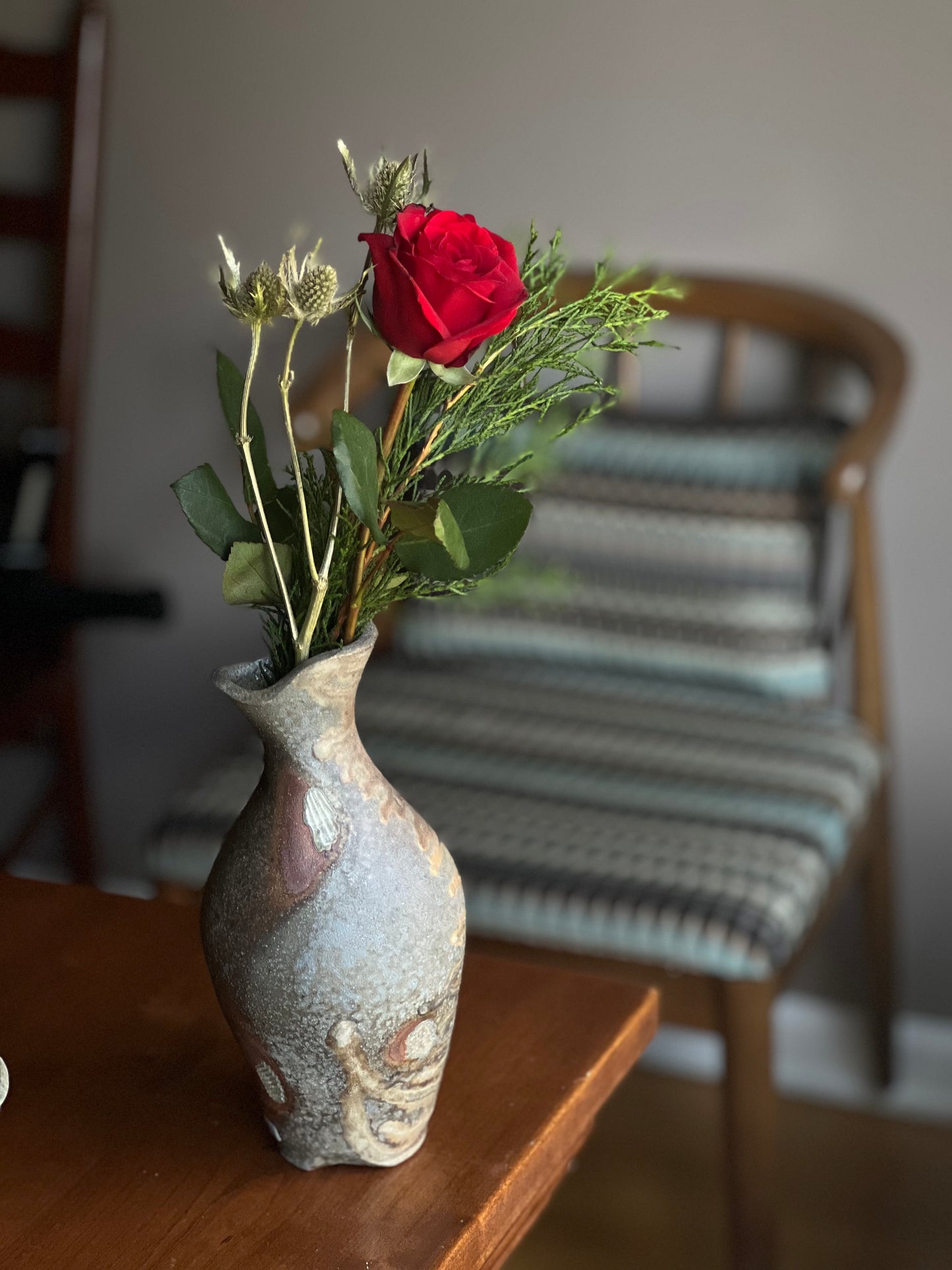 Vase perched on shells for the fire